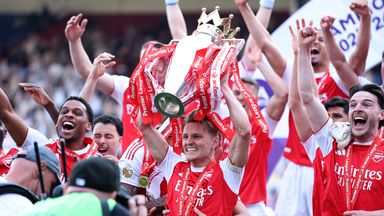 Martin Odegaard of Arsenal lifts the Premier League trophy 