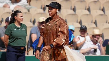 Naomi Osaka arrived for her French Open second-round contest wearing a white ​floor-length flared train over her outfit