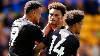 Antonee Robinson celebrates with Rodrigo Muniz and Oscar Bobb after scoring Fulham's equaliser against Wolves