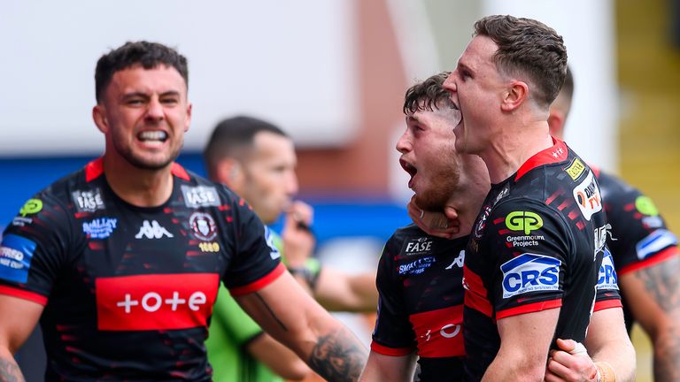 Wigan's Jack Farrimond celebrates scoring a try against St Helens