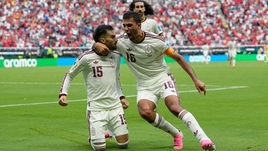 Spain's Alex Baena is congratulated after scoring his side's opening goal against Uruguay