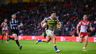 Josh Smith of Warrington makes a break to score a try