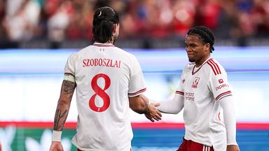 Dominik Szoboszlai celebrates with Rio Ngumoha after the teenager opens the scoring against Wrexham