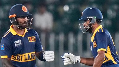 Sri Lanka's Avishka Fernando, left, celebrates with Pavan Rathnayake after hitting a boundary during the tri-series