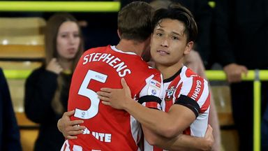 Southampton's Kuryu Matsuki (centre) celebrates with Jack Stephens (left) after scoring his sides first goal