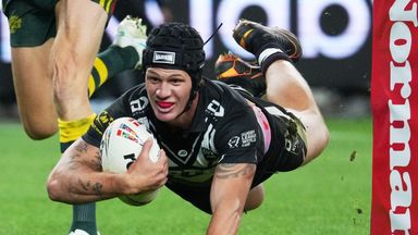 New Zealand's Kalyn Ponga scores a try during the opening game of the Rugby League World Cup between Australia and New Zealand in Sydney, Thursday, Oct. 15, 2026. (AP Photo/Mark Baker)
