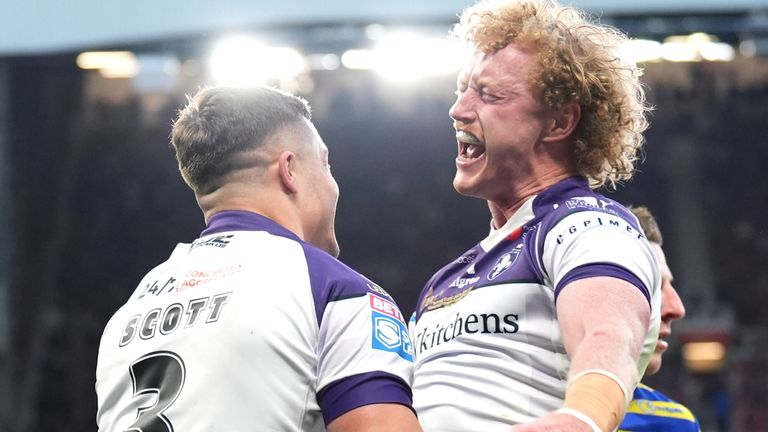 Wakefield Trinity's Cameron Scott celebrates scoring the first try of the Grand Final with Lachlan Walmsley